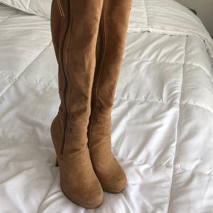 Over the knee camel colored boots.